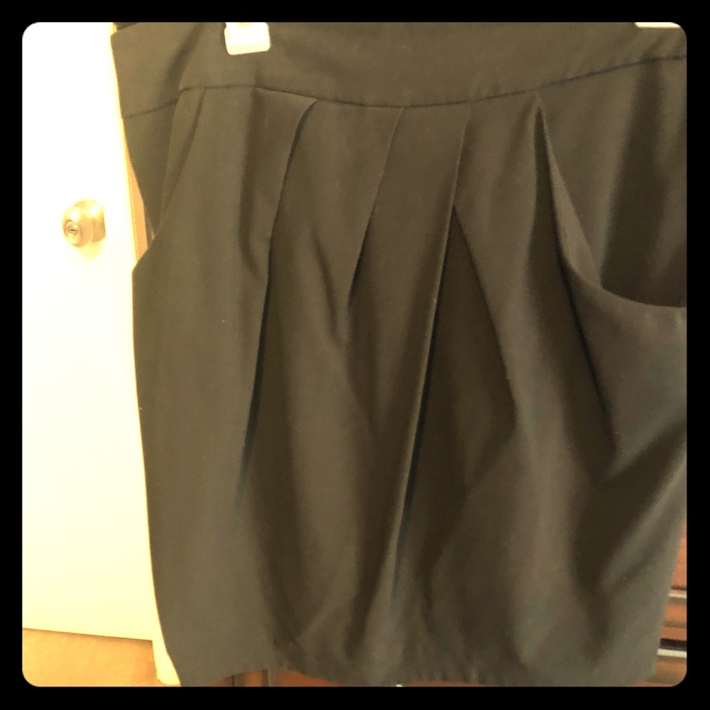Black dress skirt with pockets, zippered back